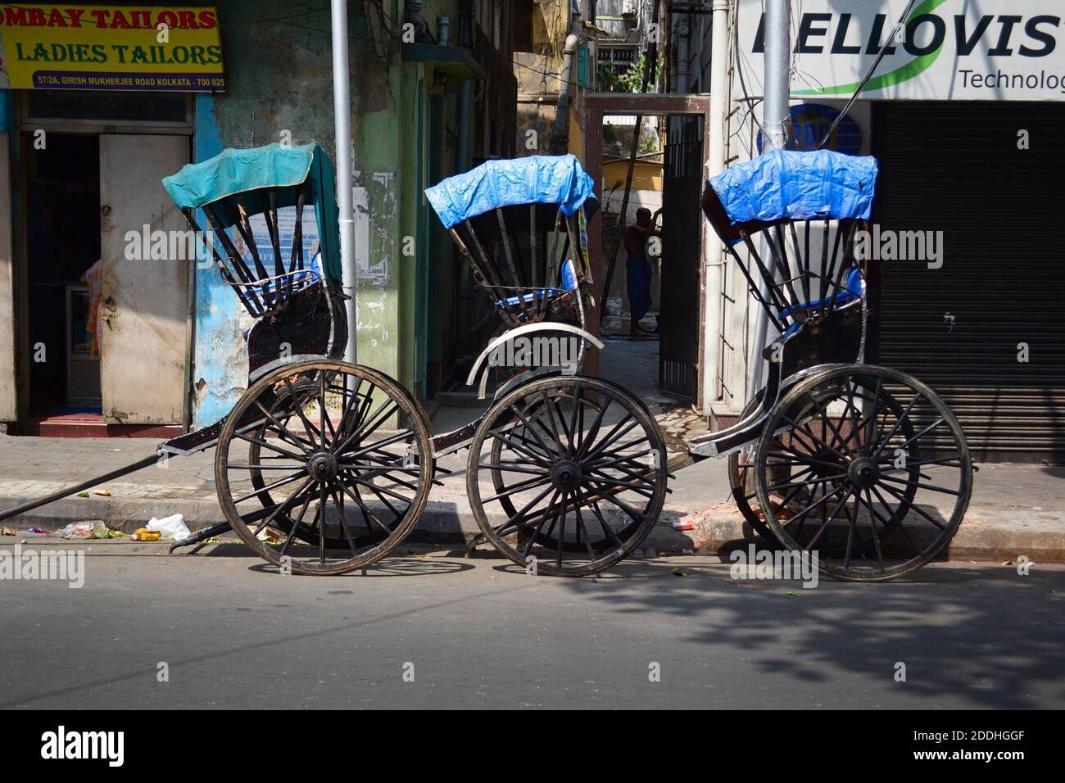 kolkata-india-march-2014-three-empty-hand-pulled-rickshaw-carts-parked-along-the-road-on-street-in-historical-town-in-calcutta-2DDHGGF-952382693.jpg.4adc2500294a18f8df00fc117232135f.jpg